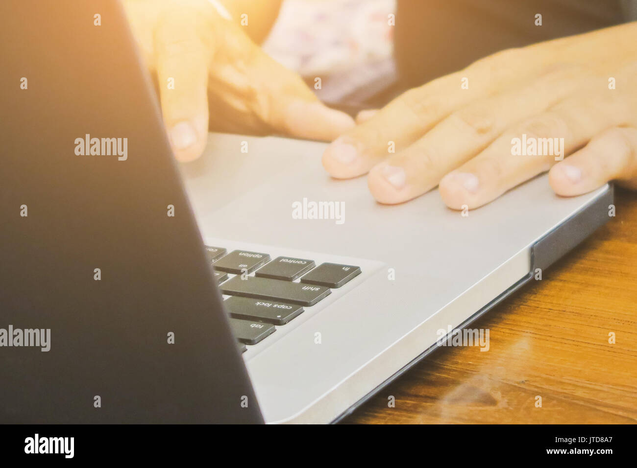 Close-up of female hands using laptop computer, working on laptop with ...