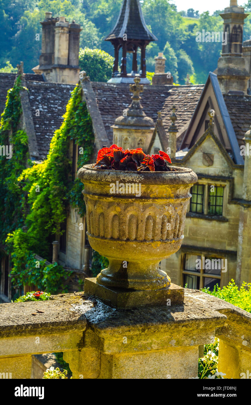 Concrete flower pots in the garden on a pedestal stylized antique, a