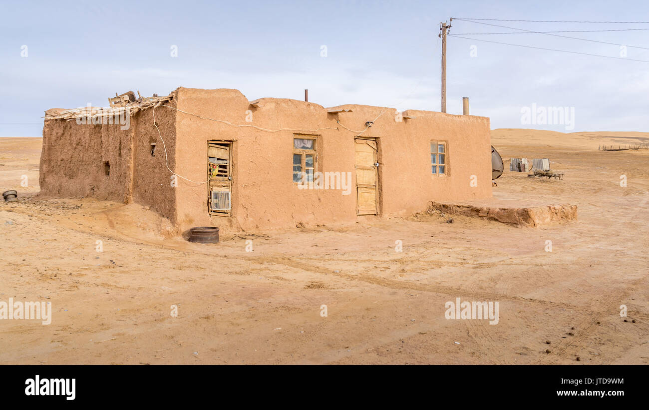 Old, weathered mud building in Damla, Turkmenistan. Stock Photo