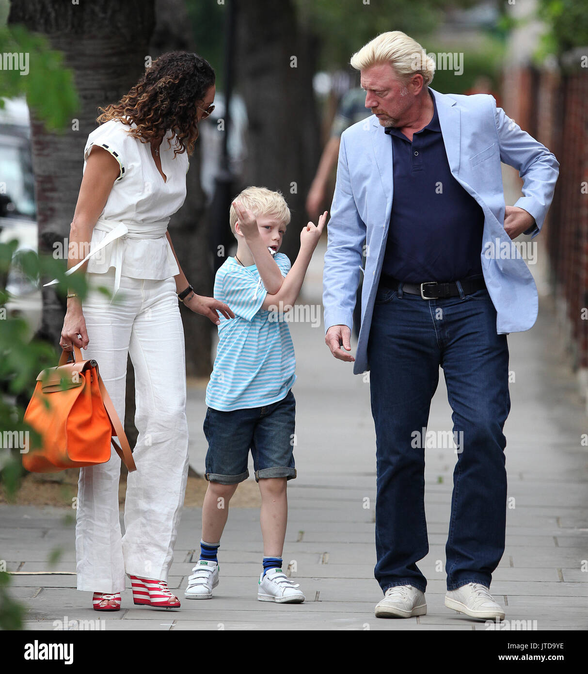 Well dressed Boris Becker and Lilly Becker take their son Amadeus on a  family day out while on a break from the Wimbledon Championships. Boris is  seen with yet another brand new