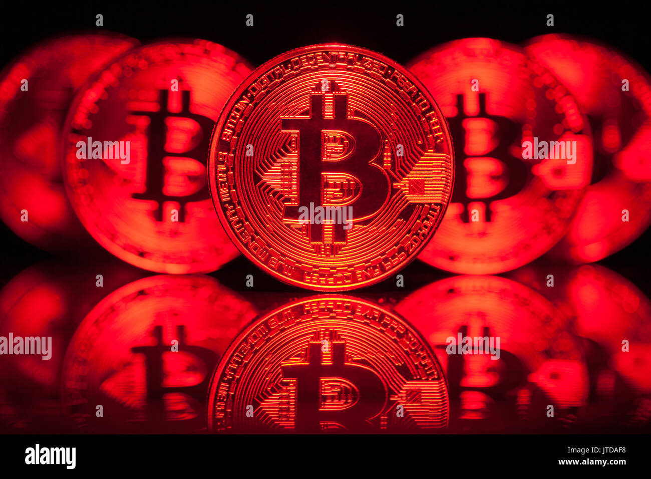 Five Virtual Coins Bitcoins On Printed Circuit Board. Stock Photo