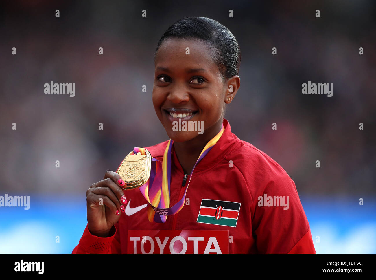 Kenya's Faith Chepngetich Kipyegon with her Gold Medal for the Women's