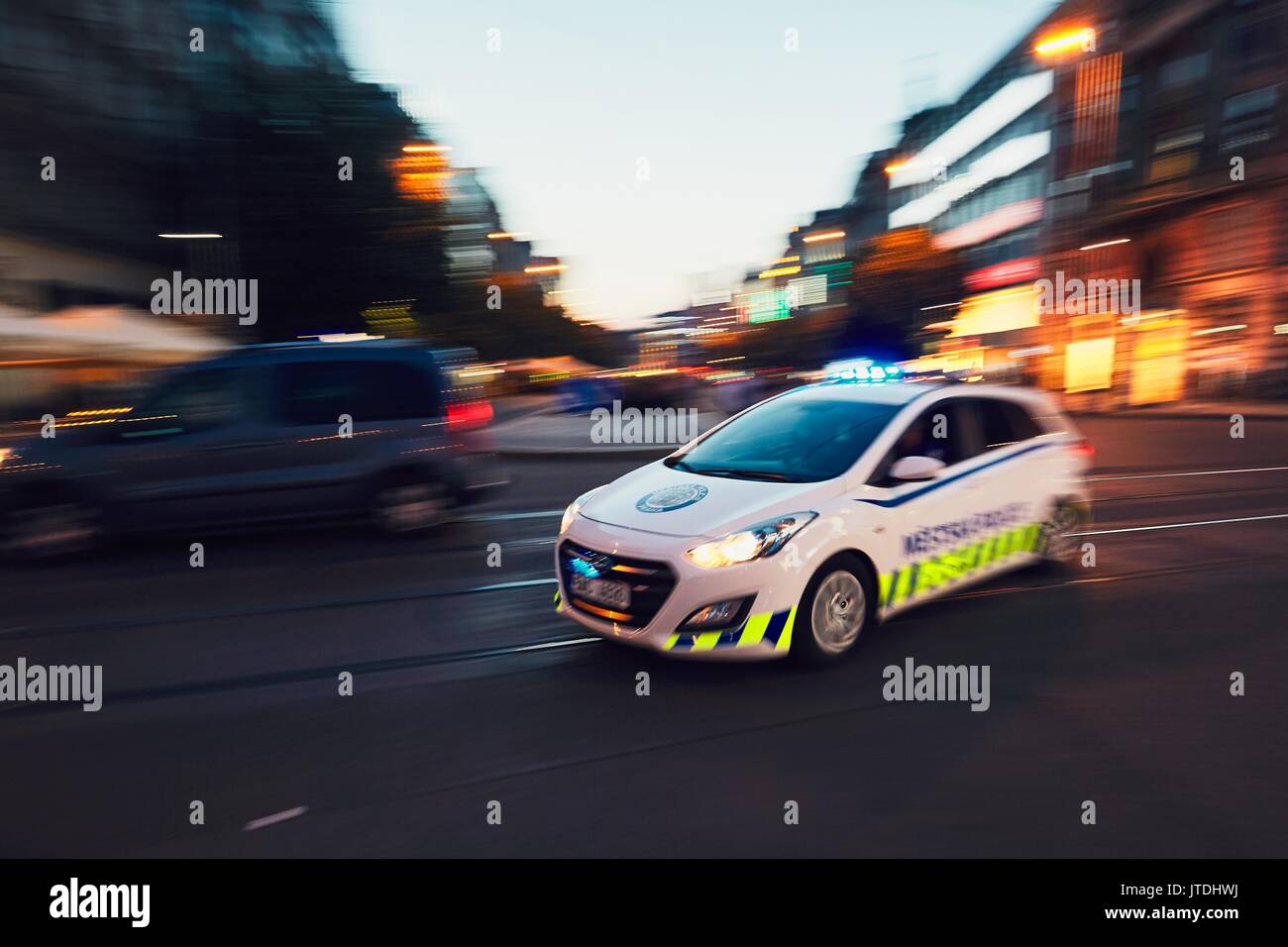 PRAGUE, CZECH REPUBLIC - JUNE 27, 2017: The patrol of Municipal Police of the City of Prague (in blurred motion) respond to an emergency call on June  Stock Photo