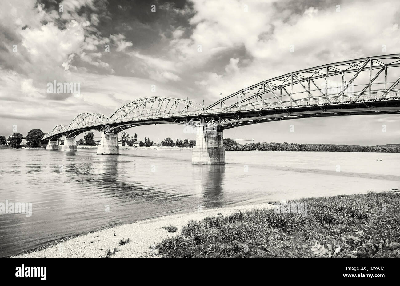 Maria Valeria bridge joins Esztergom in Hungary and Sturovo in Slovak republic across the Danube river. Transportation theme. Black and white photo. Stock Photo