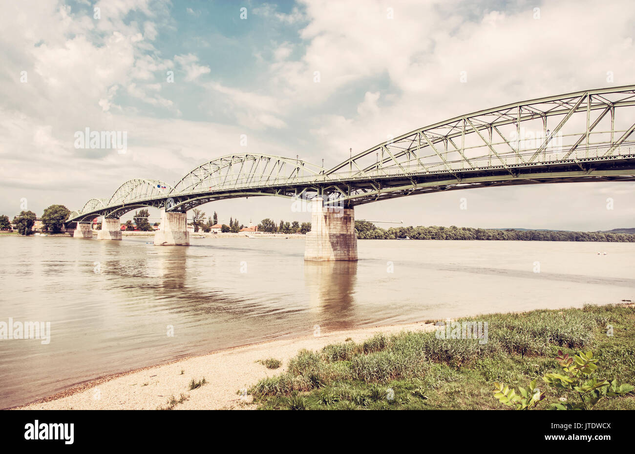 Maria Valeria bridge joins Esztergom in Hungary and Sturovo in Slovak republic across the Danube river. Transportation theme. Architectural scene. Ret Stock Photo