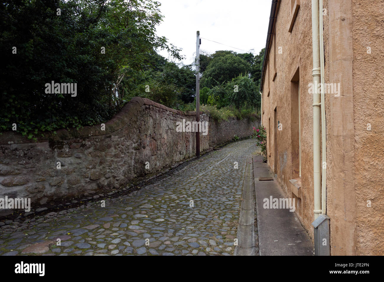 Scotland, Highlands, Town of Cromarty, Scottish Scenery, Housing, Exterior, Cobbled Road, Greenery, Trees, Landscape, Walkway, Property Stock Photo