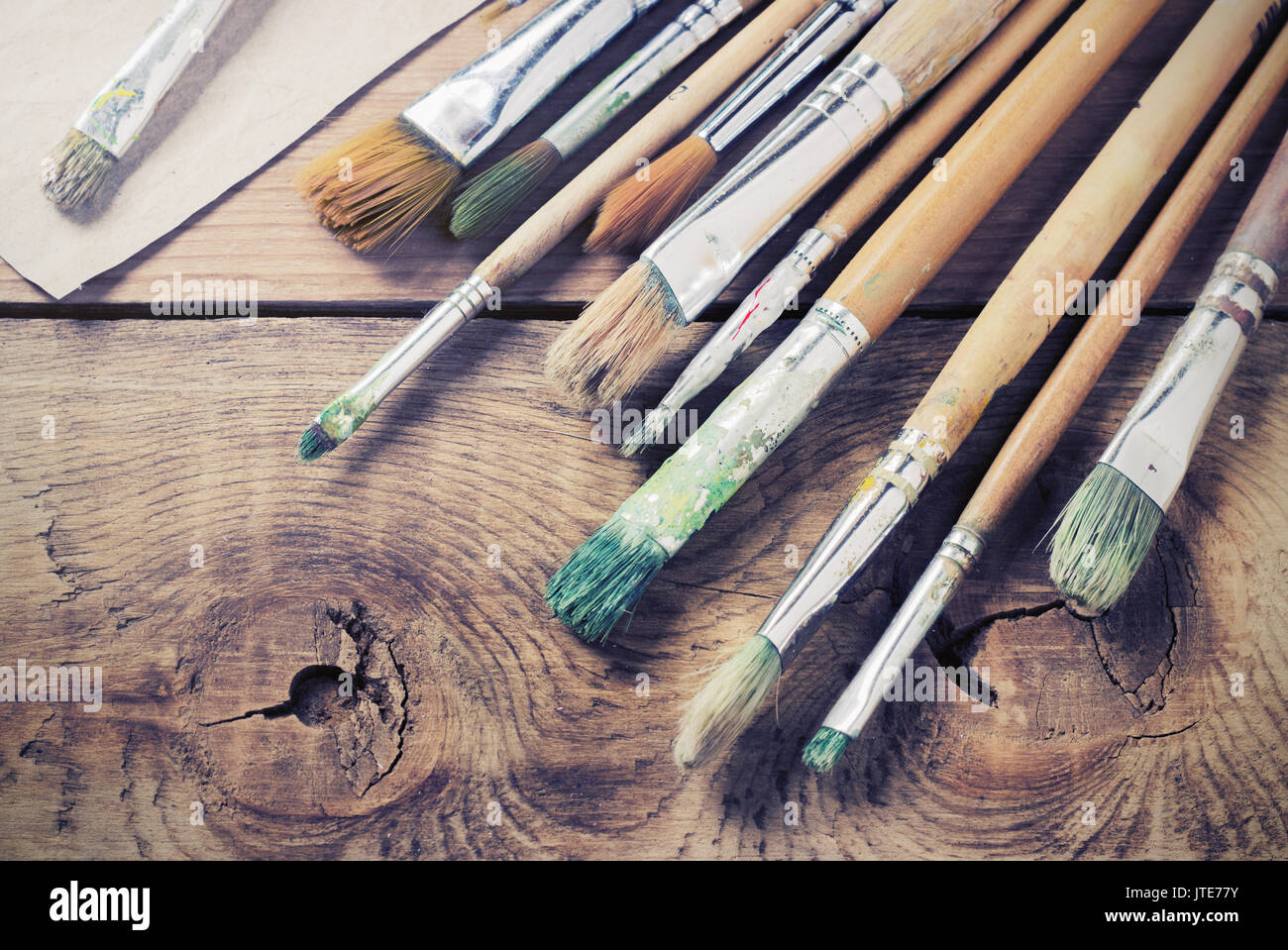 Paint brushes for painting on a wooden background toning Stock Photo