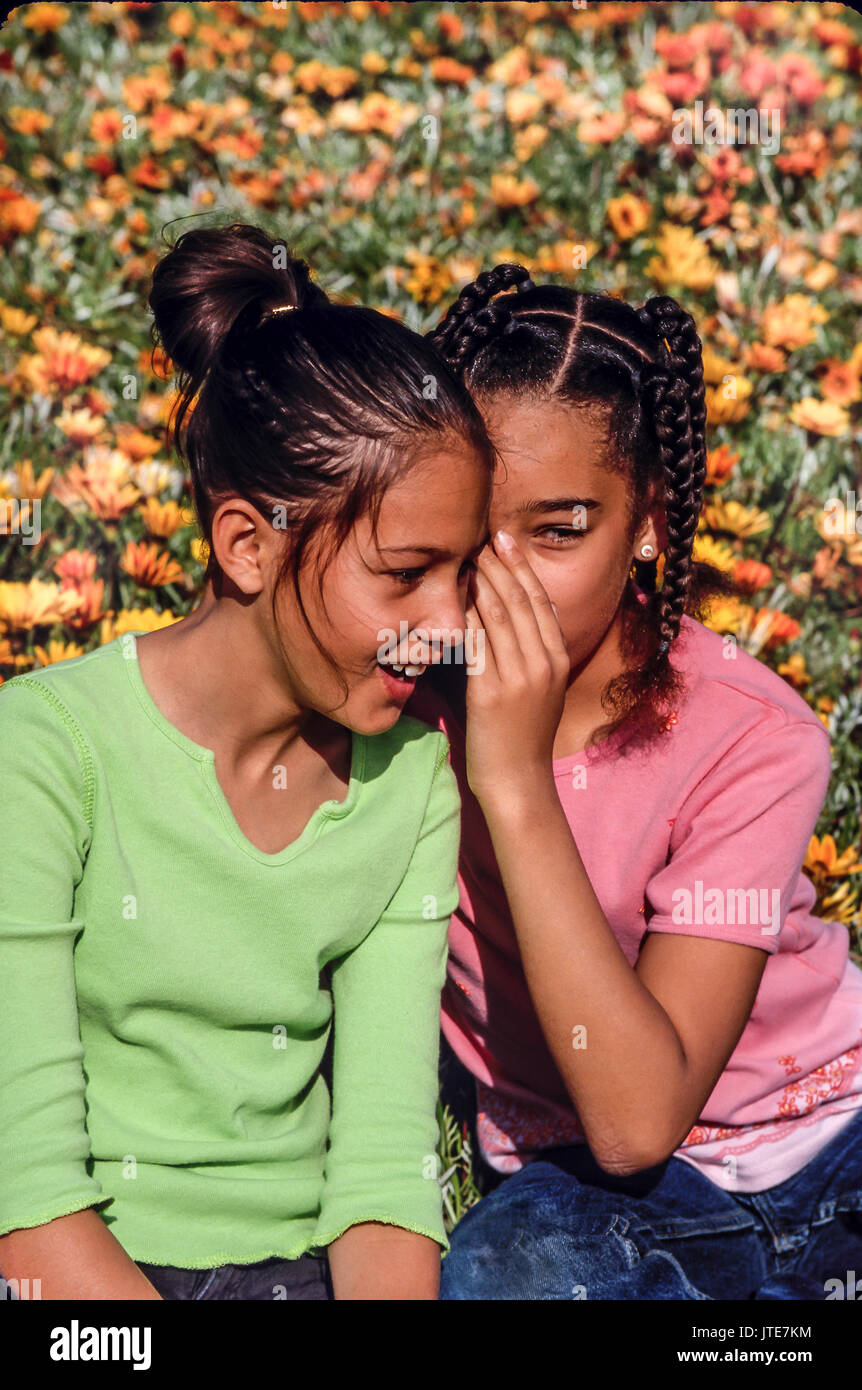 outdoorsTwo girls tell secrets whispering into ear of friend © Myrleen Pearson Stock Photo