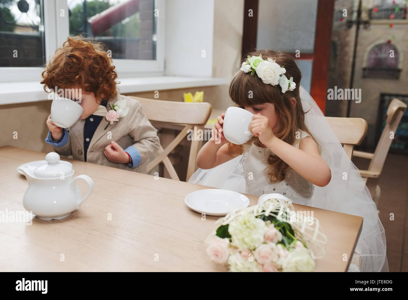 Boy girl playing tea party hi-res stock photography and images - Alamy