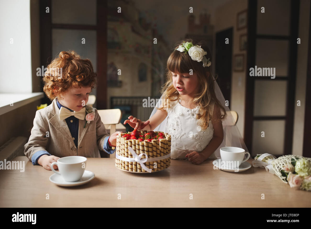 Boy girl playing tea party hi-res stock photography and images - Alamy