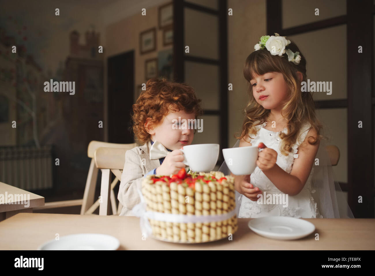 Boy girl playing tea party hi-res stock photography and images - Alamy