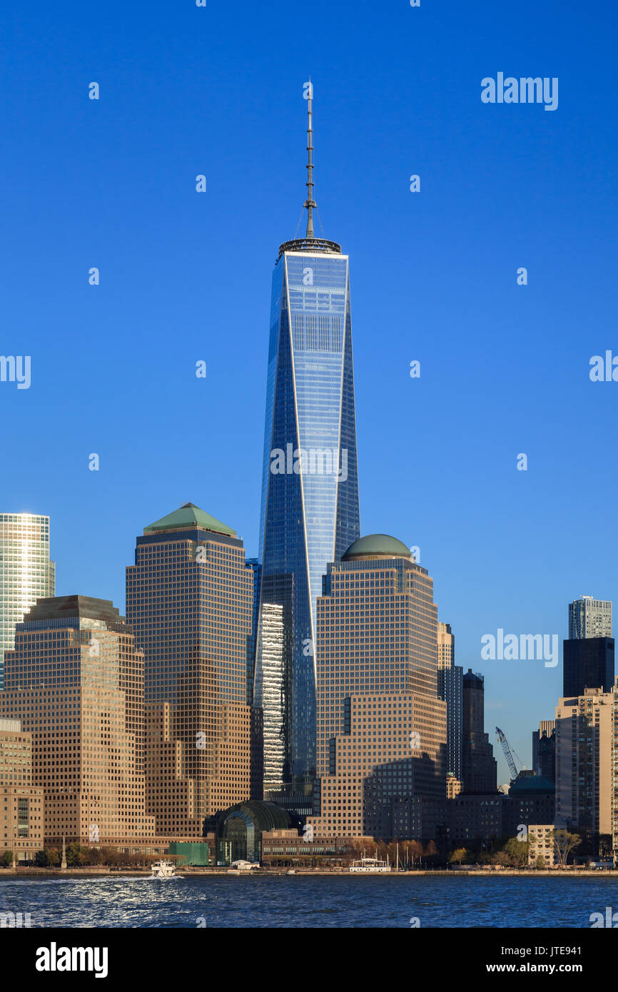 The Lower Manhattan skyline in New York City.  One World Trade Center dominates the skyline above Two and Three World Financial Centers. Stock Photo