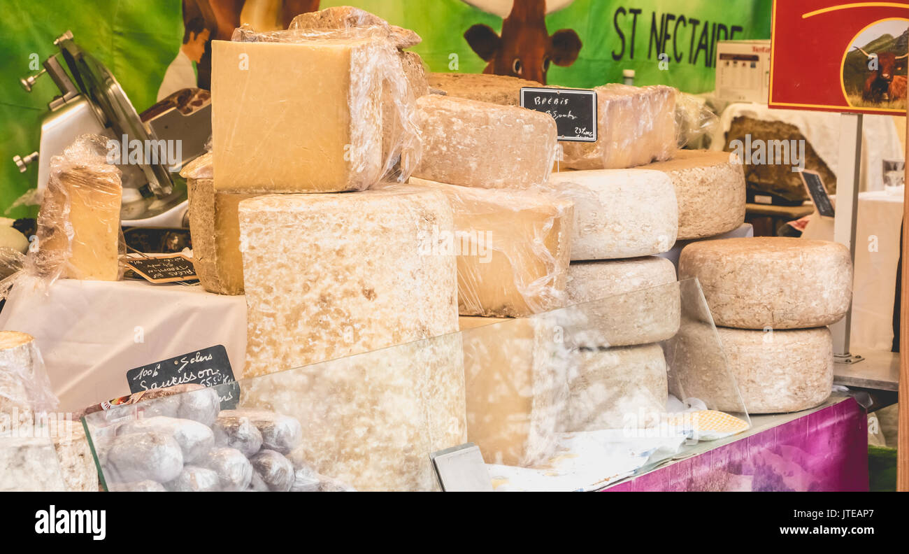 LA ROCHE-SUR-YON, FRANCE - december 19, 2016 : Display of French cheeses and sausages on a street market Stock Photo