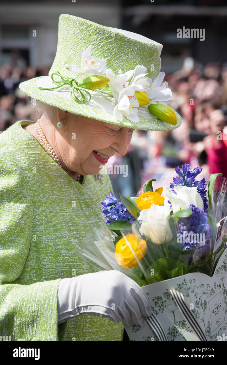 Her Majesty, Queen Elizabeth II, admires a bunch of flowers given to her at Windsor Castle to celebrate her 90th Birthday, 21st April 2016Angela Kelly Stock Photo