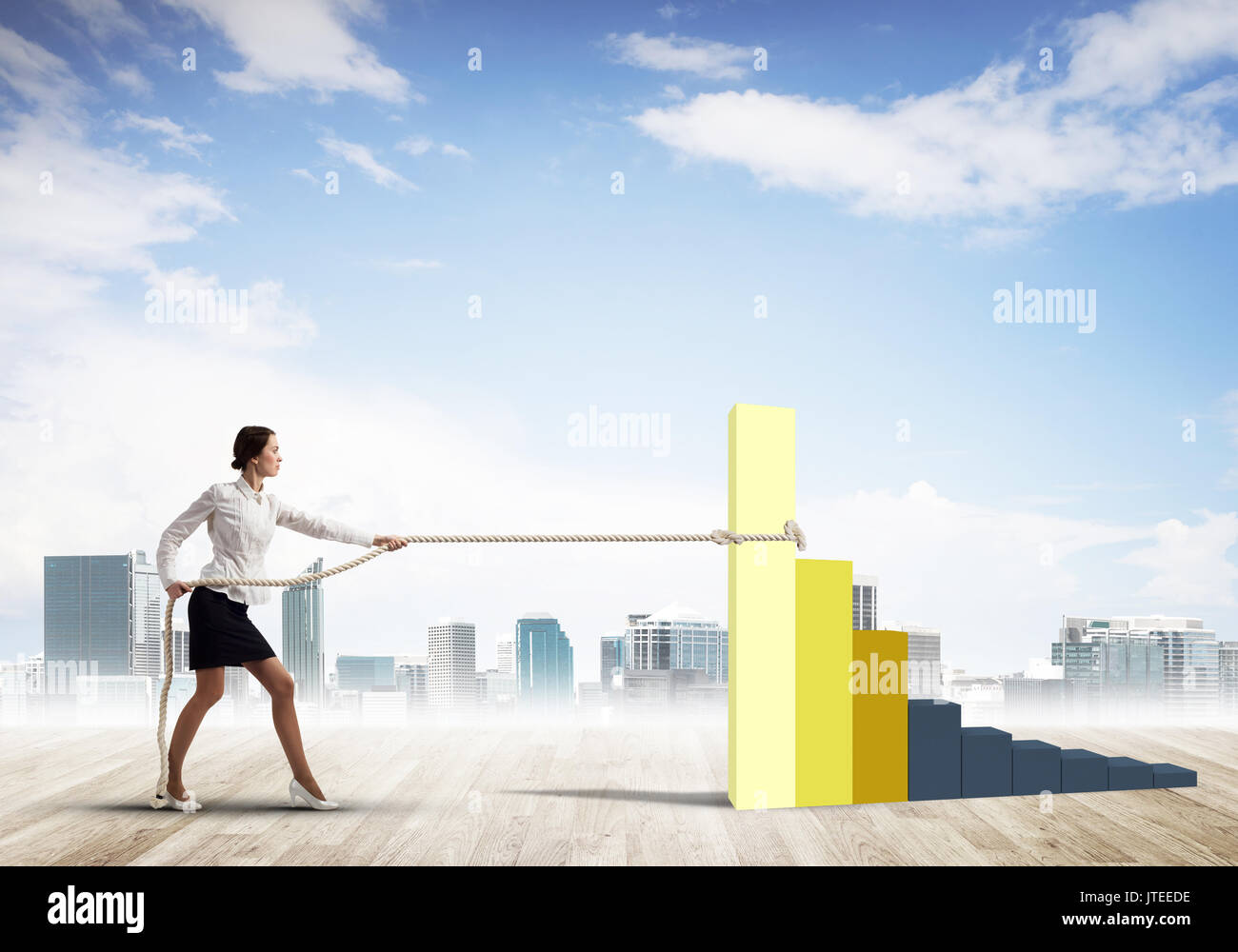 Businesswoman pulling arrow with rope and making it raise up Stock Photo