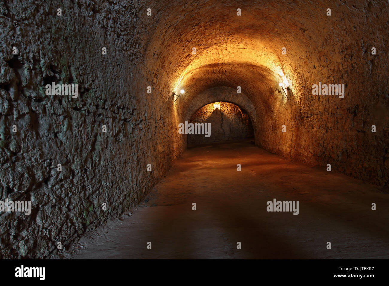 Well lit catacombs of the castle in Dubno, Ukraine Stock Photo