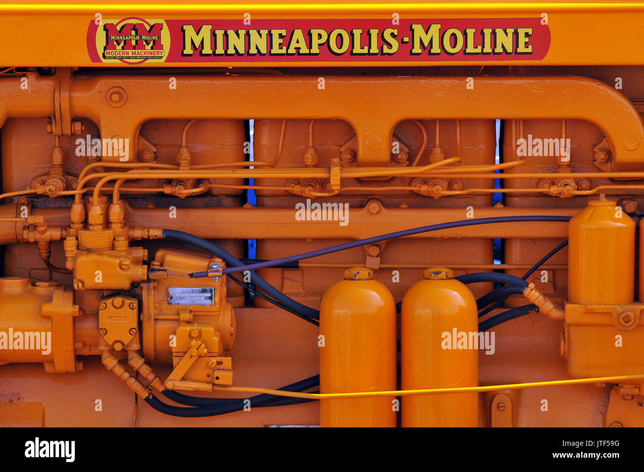 vintage tractors on display in fully restored condition at a show of