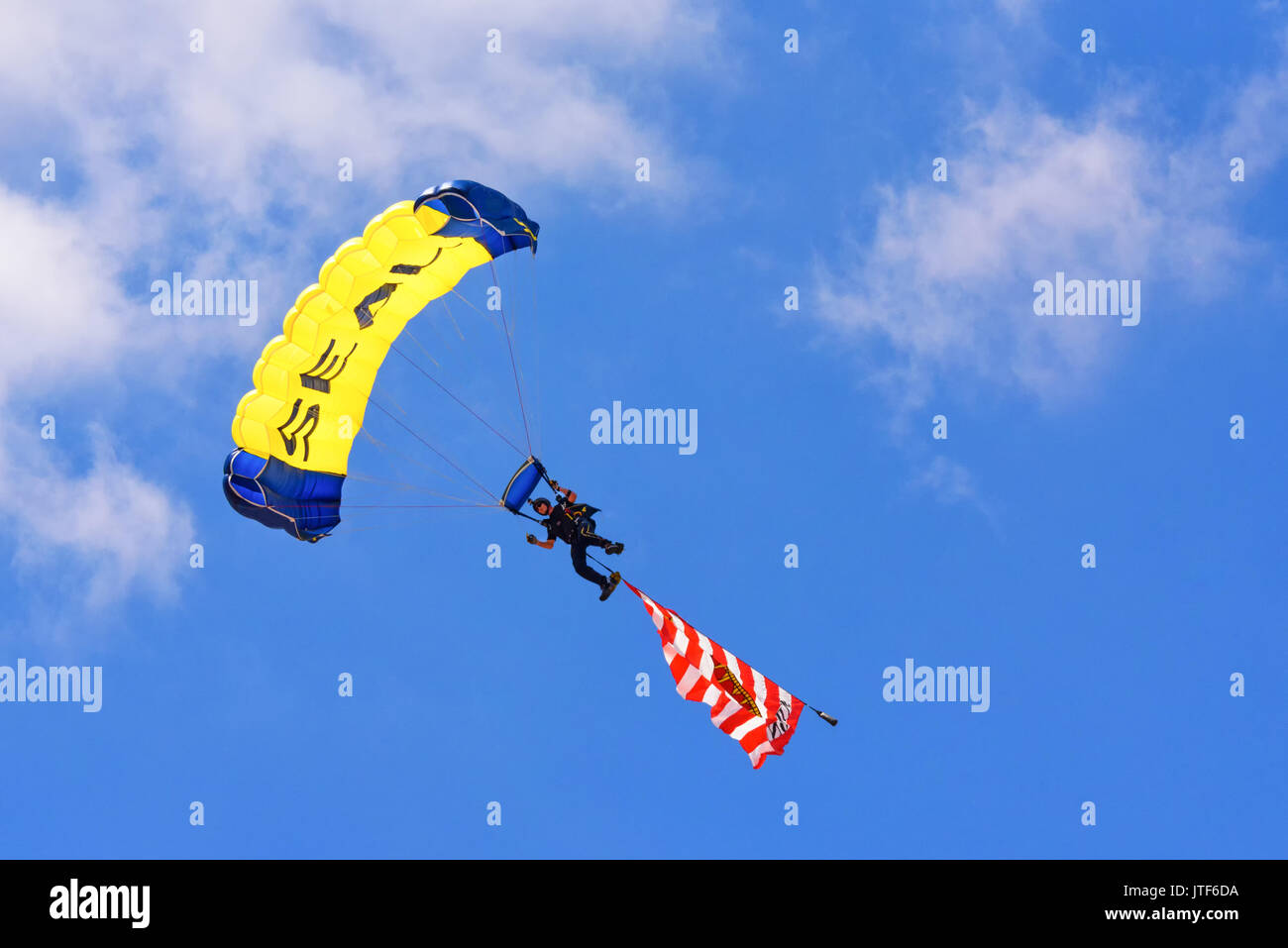 CHEYENNE, WYOMING, USA - JULY 27, 2017: US Navy Leapfrog team of skydivers opens the annual Frontier Days Rodeo. The Gadsden flag 'DON'T TREAD ON ME' Stock Photo