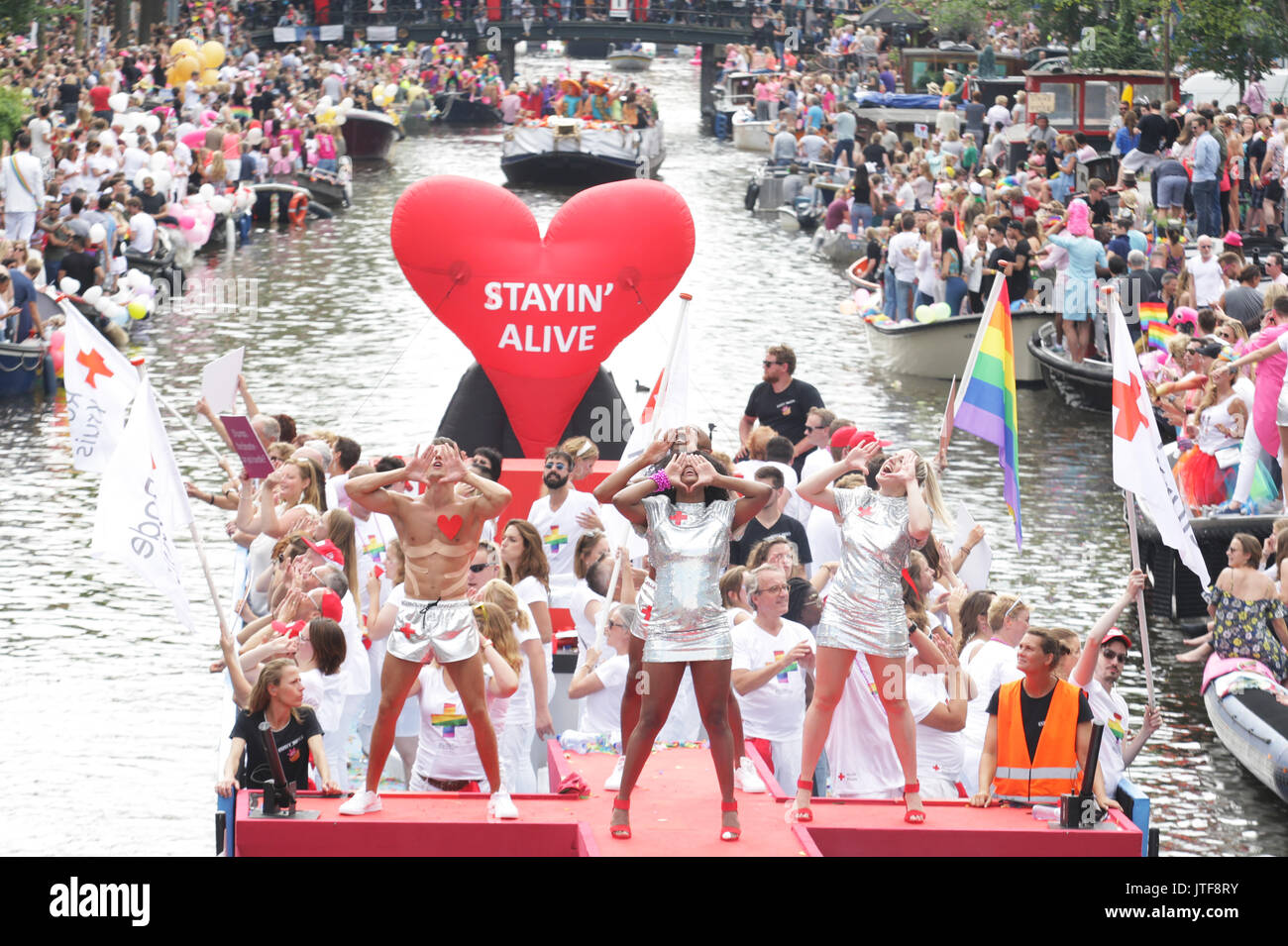 Revelers On The Boat In The Prinsengracht Canal Participating In The Amsterdam Canal Parade