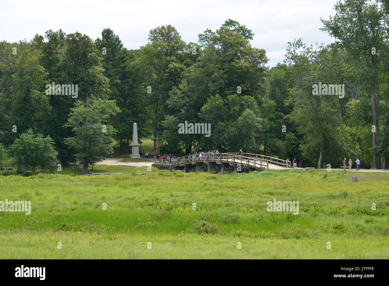 Old North Bridge with soldier reenactments at the Minuteman national historic park in Concord, Massachusetts Stock Photo