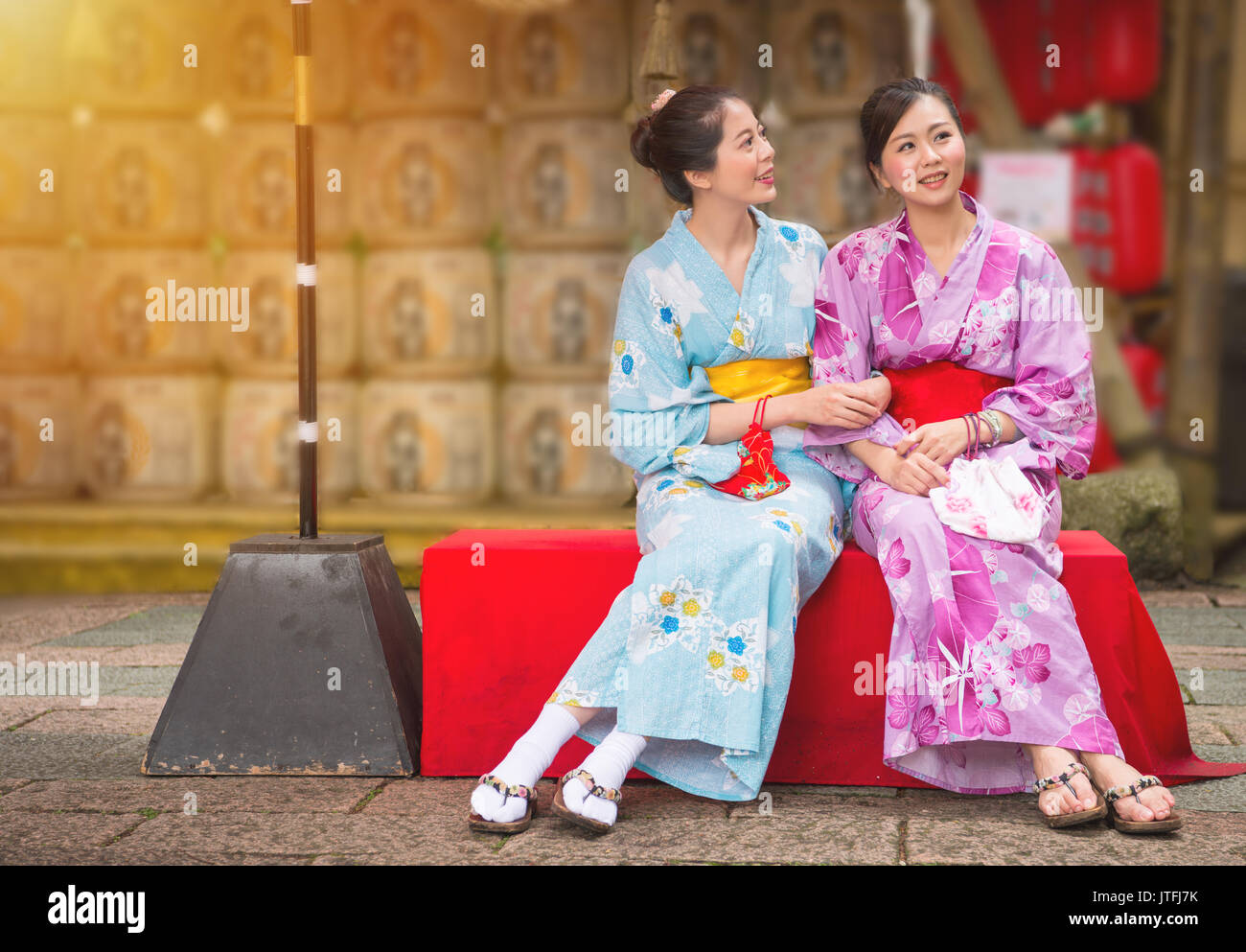best girlfriends sitting on the culture street in Japanese festival with  neat lantern background, women wearing japan traditional kimono enjoying  art Stock Photo - Alamy