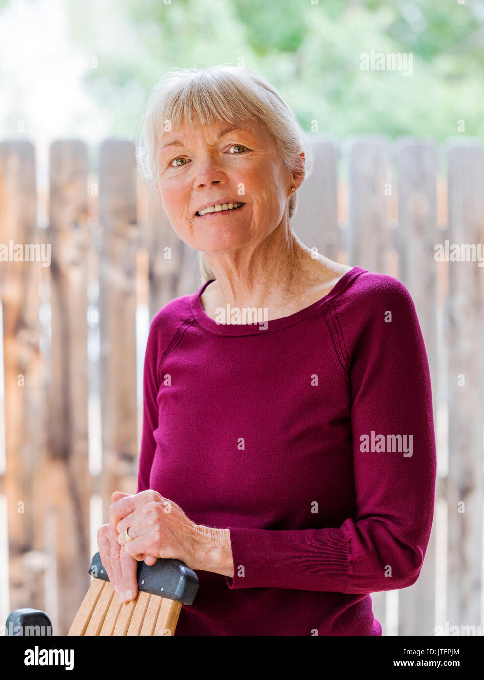 Senior woman posing outdoors hi-res stock photography and images - Alamy