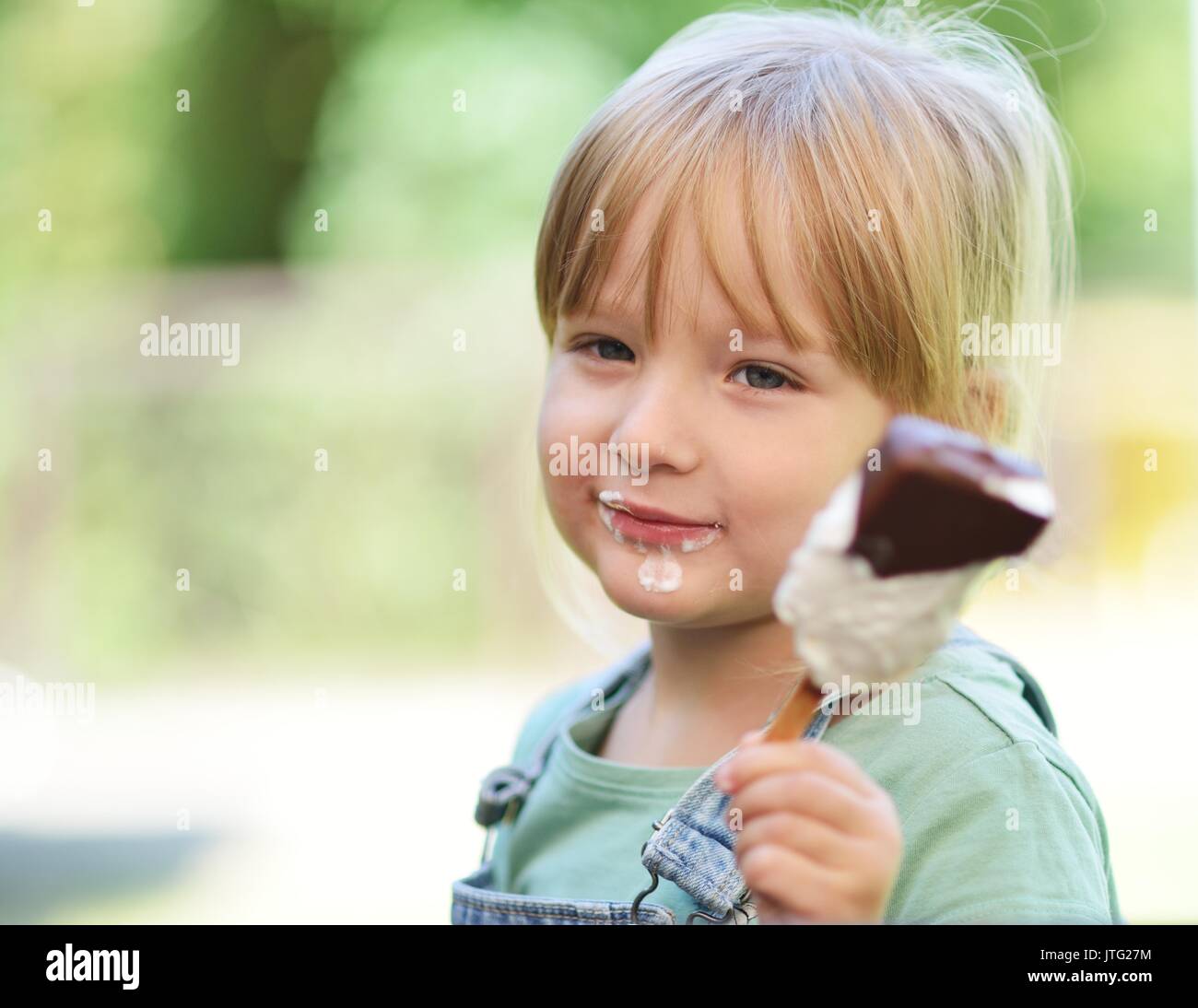 Child eating icecream. Stock Photo