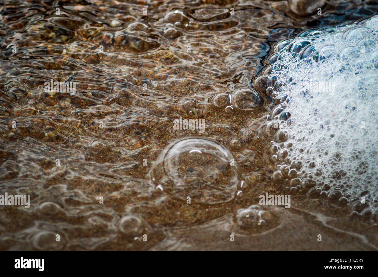 bubbles and foam on waters surface Stock Photo