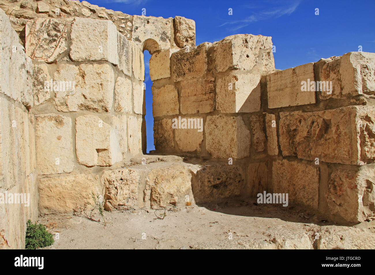 Inside a medieval castle arrow slit in the historic wall of Old Jerusalem, Israel. Stock Photo