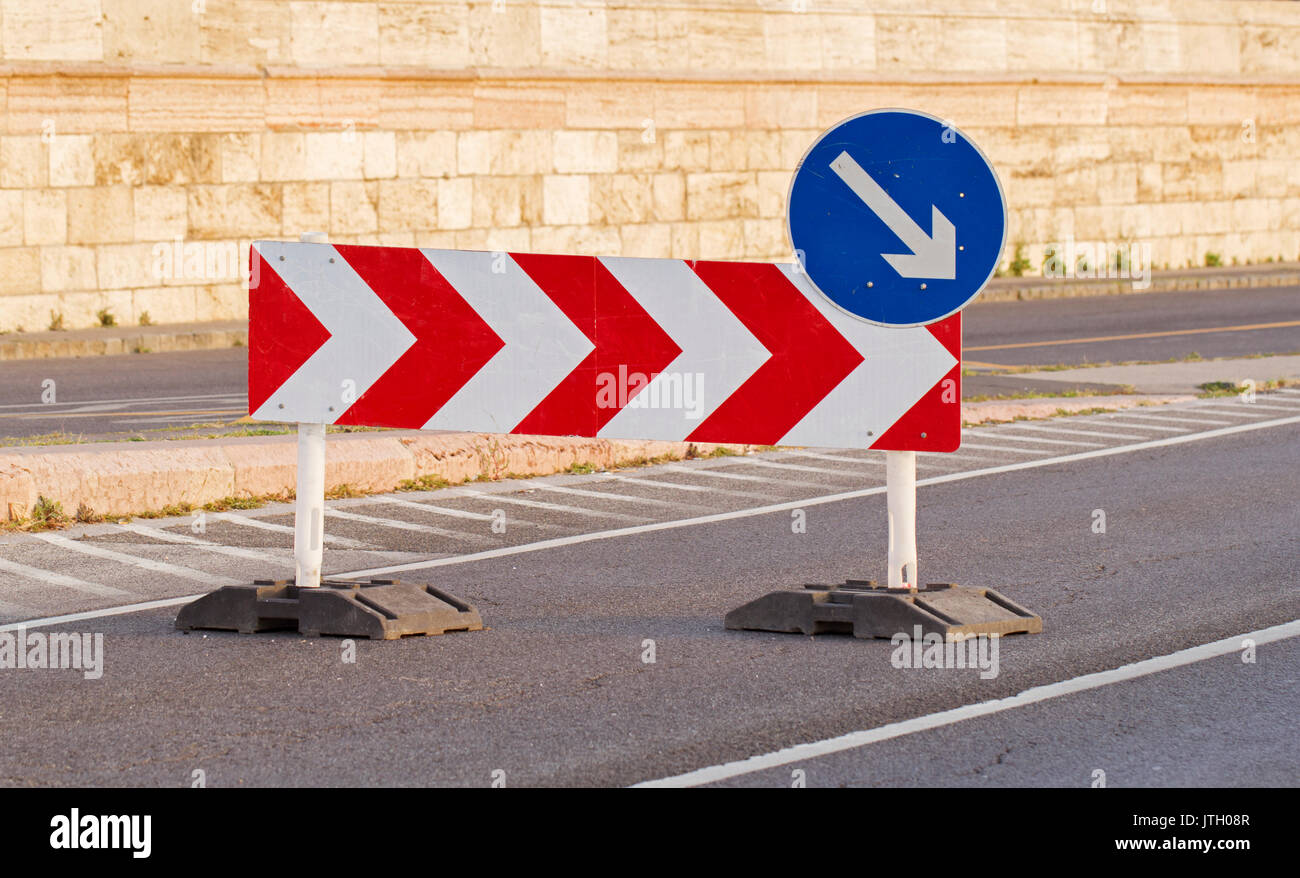Sign on the road meaning a detour on the right Stock Photo