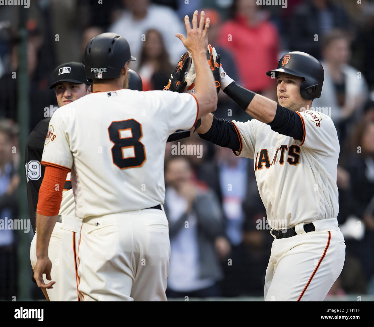 San Francisco, California, USA. 08th Aug, 2017. San Francisco Giants first baseman Buster Posey (28) gets high fives for his first inning three run home run, during a MLB game between the Chicago Cubs and the San Francisco Giants at AT&T Park in San Francisco, California. Credit: Cal Sport Media/Alamy Live News Stock Photo