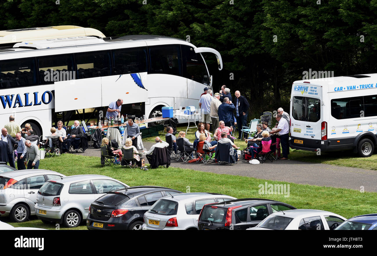 Brighton, UK. 9th Aug, 2017. Racegoers enjoy a picnic before the rain arrives at the Marstons Race Day in the Maronthonbet Festival of Racing at Brighton Racecourse Credit: Simon Dack/Alamy Live News Stock Photo