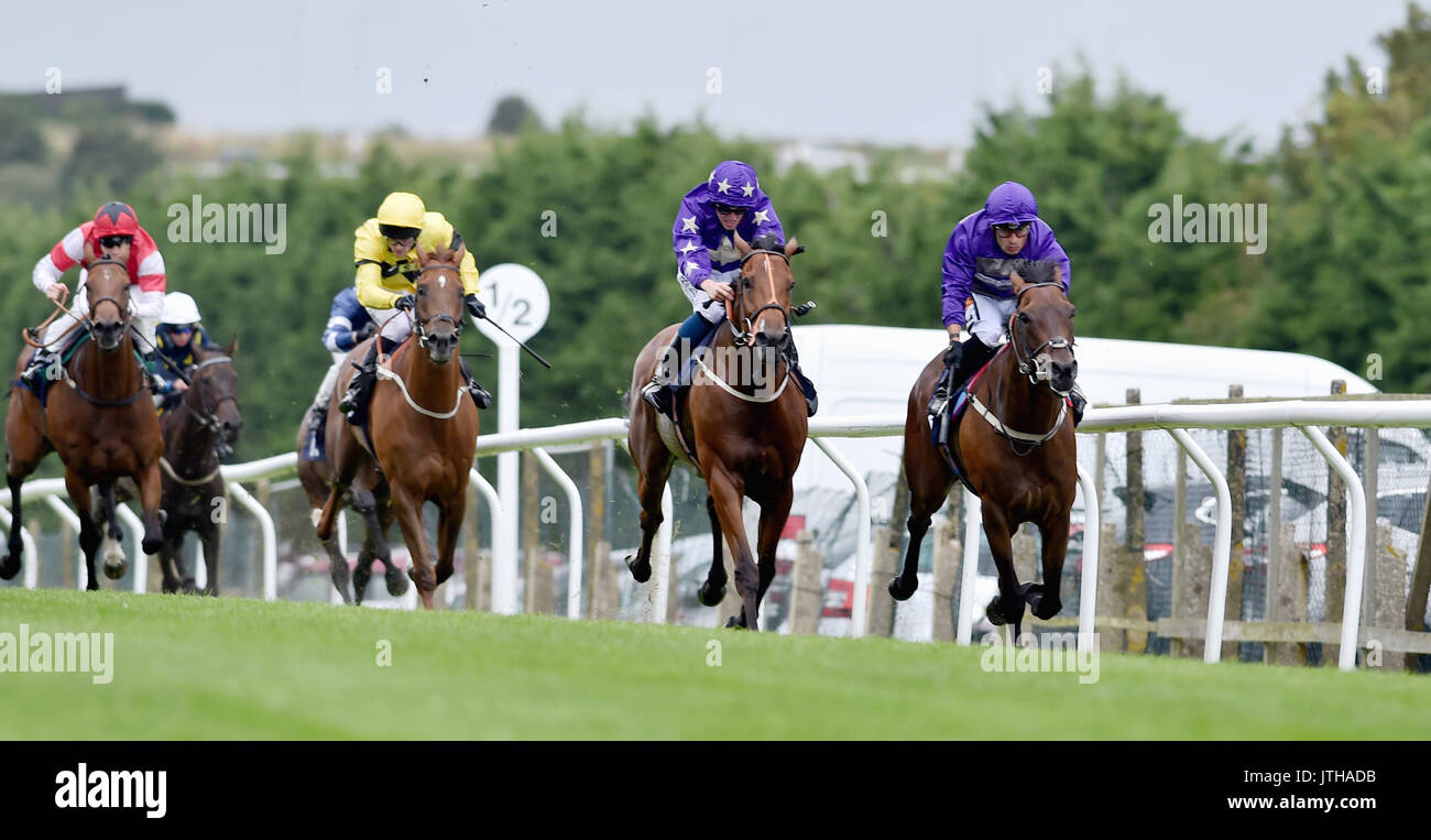 Brighton, UK. 9th Aug, 2017. Jockey Silvestre De Sousa wins the Shipyard Brewery Handicap Stakes on Overhaugh Street (far right) at the Marstons Race Day in the Maronthonbet Festival of Racing at Brighton Racecourse Credit: Simon Dack/Alamy Live News Stock Photo