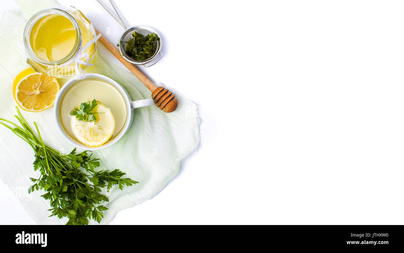 Parsley tea with lemon and honey on white Stock Photo Alamy
