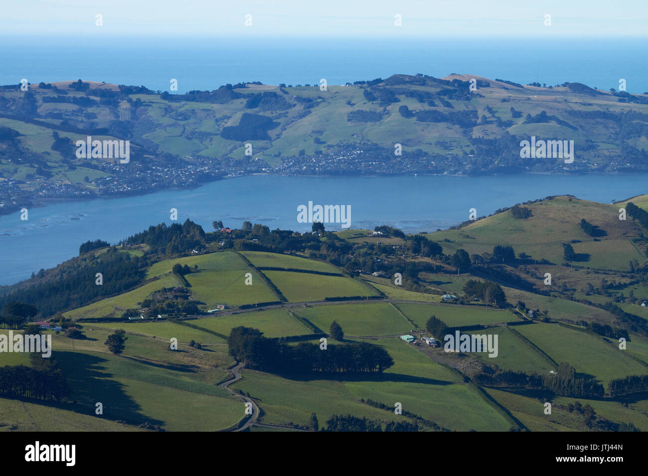 Farmland at Upper Junction, and Otago Harbour and Otago Peninsula, Dunedin, South Island, New Zealand Stock Photo