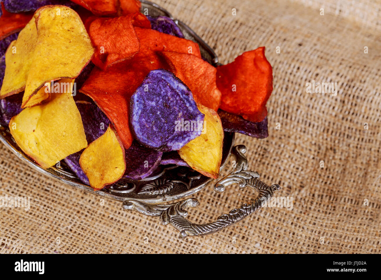 Potato red blue chips Beet and carrot salty chips in the bag from the