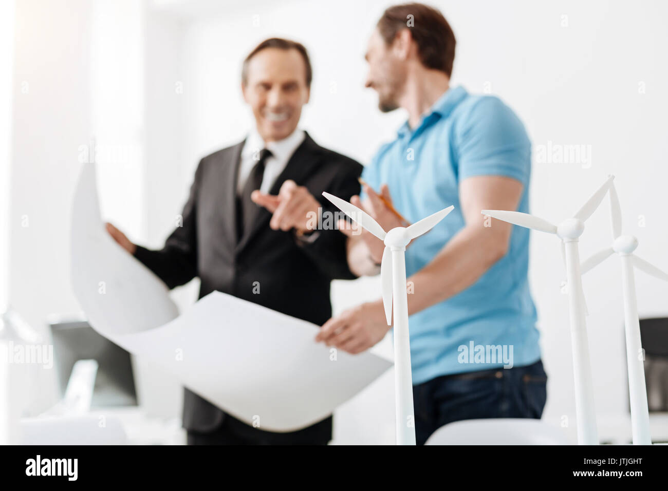 Two engineers discussing a new power station project Stock Photo