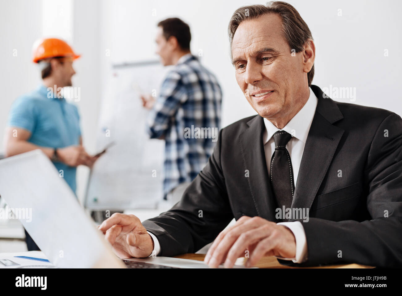 Inform Chief Engineer Chief engineer looking through information in the Internet Stock Photo ...