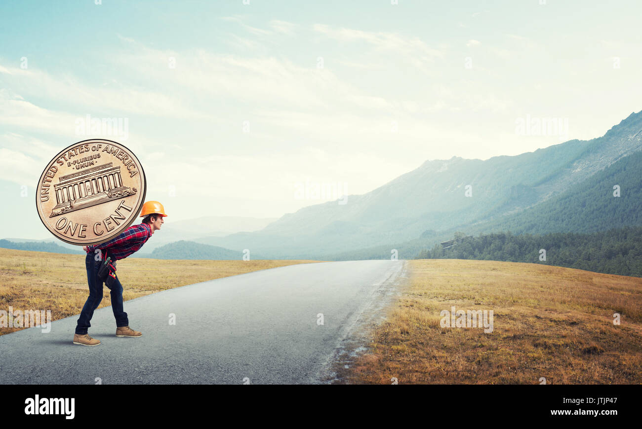 Builder man carry coin Stock Photo Alamy