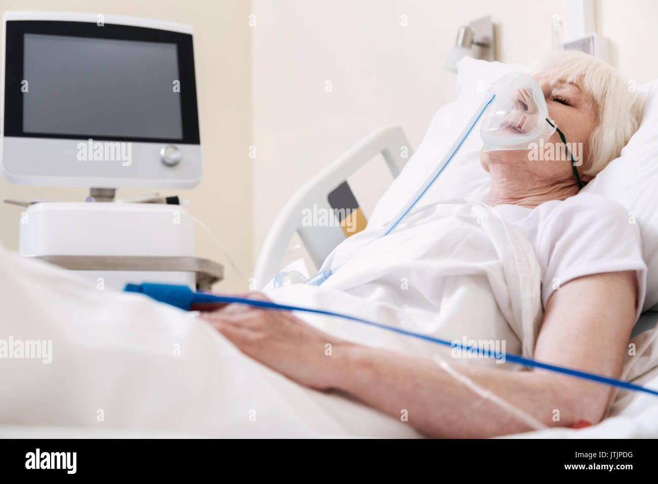 Lucky sore lady being treated using specialized equipment Stock Photo