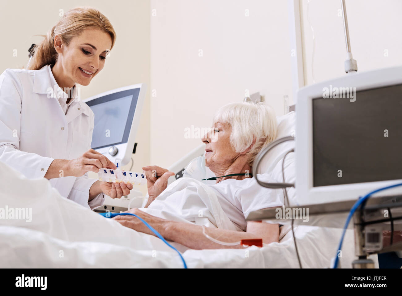 Doctor giving prescription senior hi-res stock photography and images ...