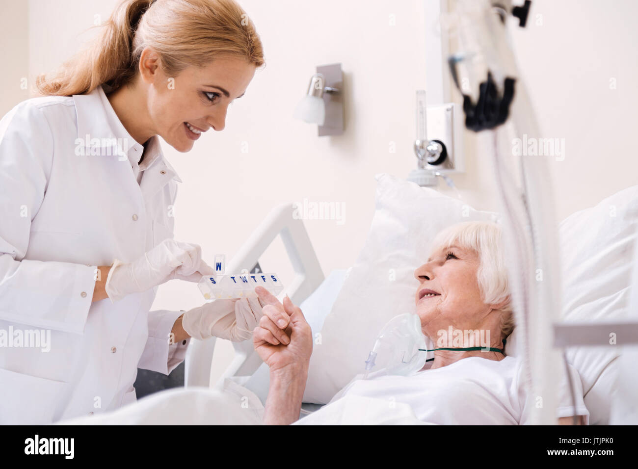 Clever sore lady curious about her treatment Stock Photo Alamy