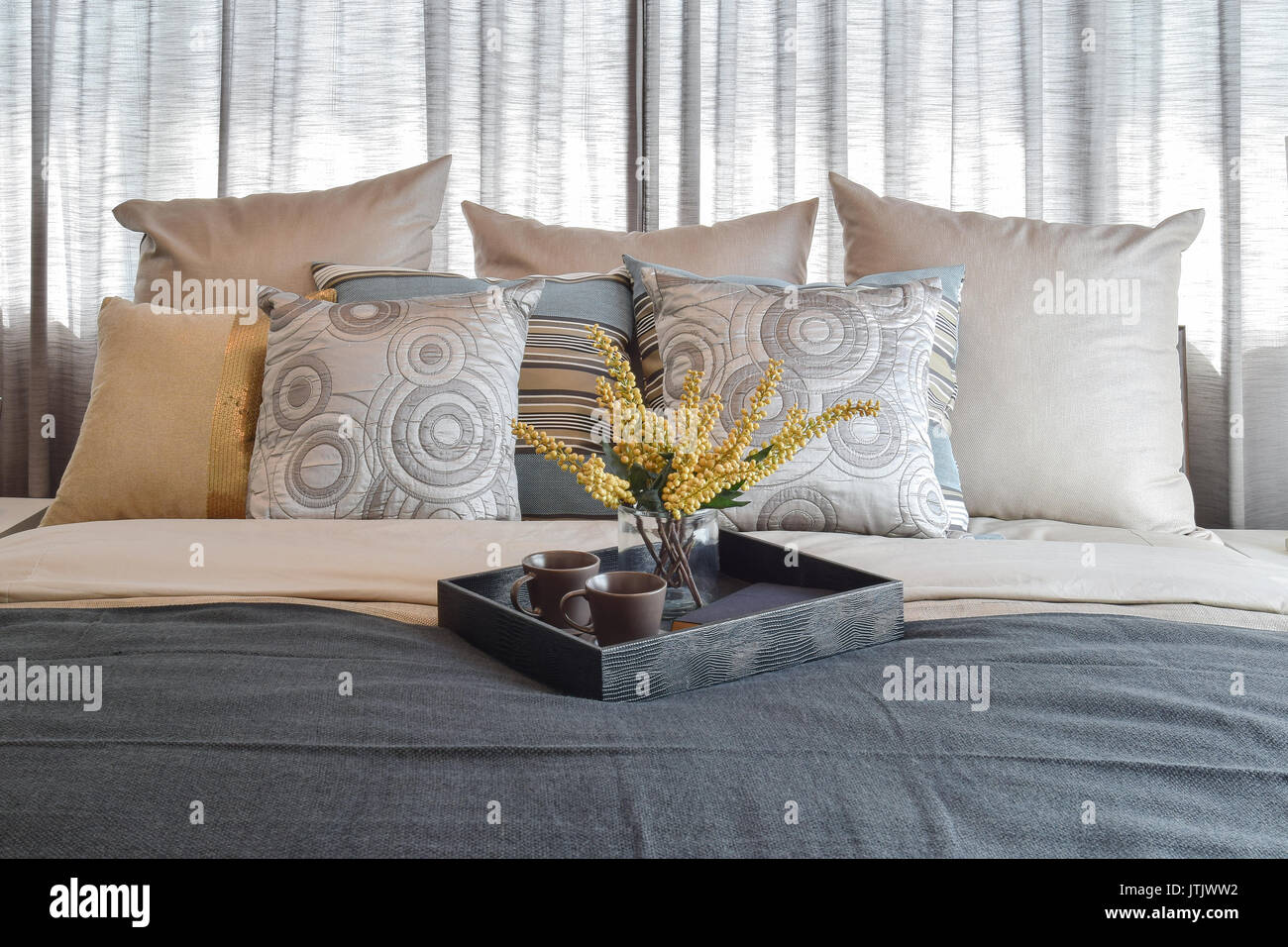 luxury bedroom interior design with striped pillows and decorative tea ...