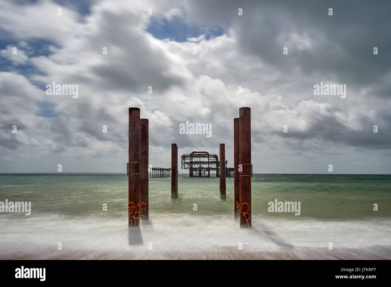 Brighton beach and the remains off the West pier long exposure East Sussex Stock Photo