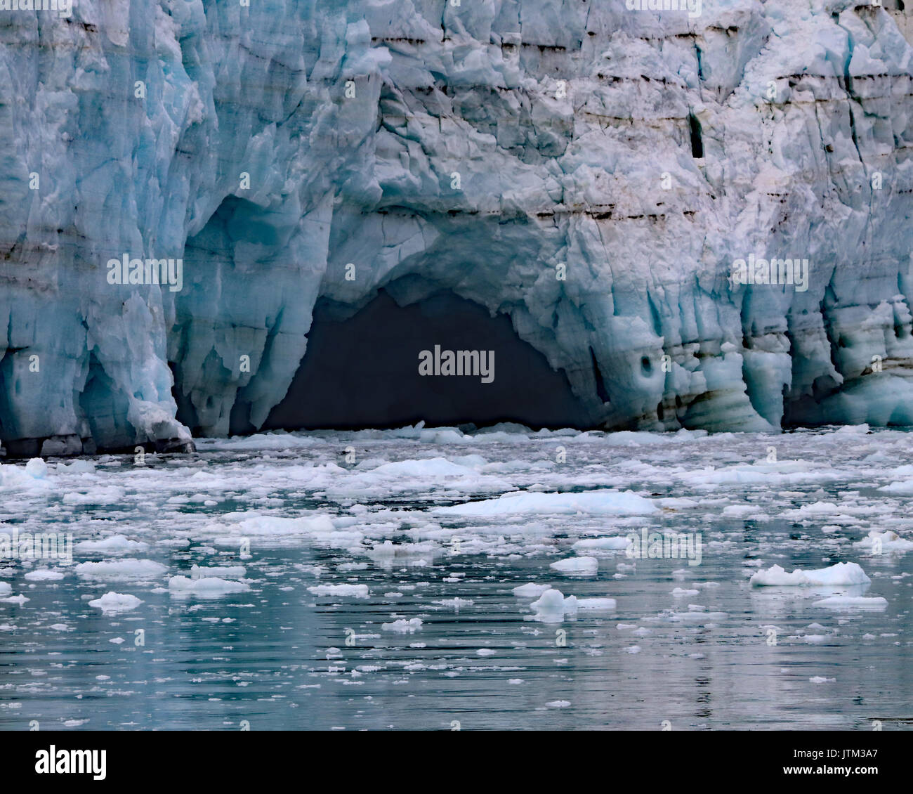 Melt water caves on Margerie glacier closeup Stock Photo