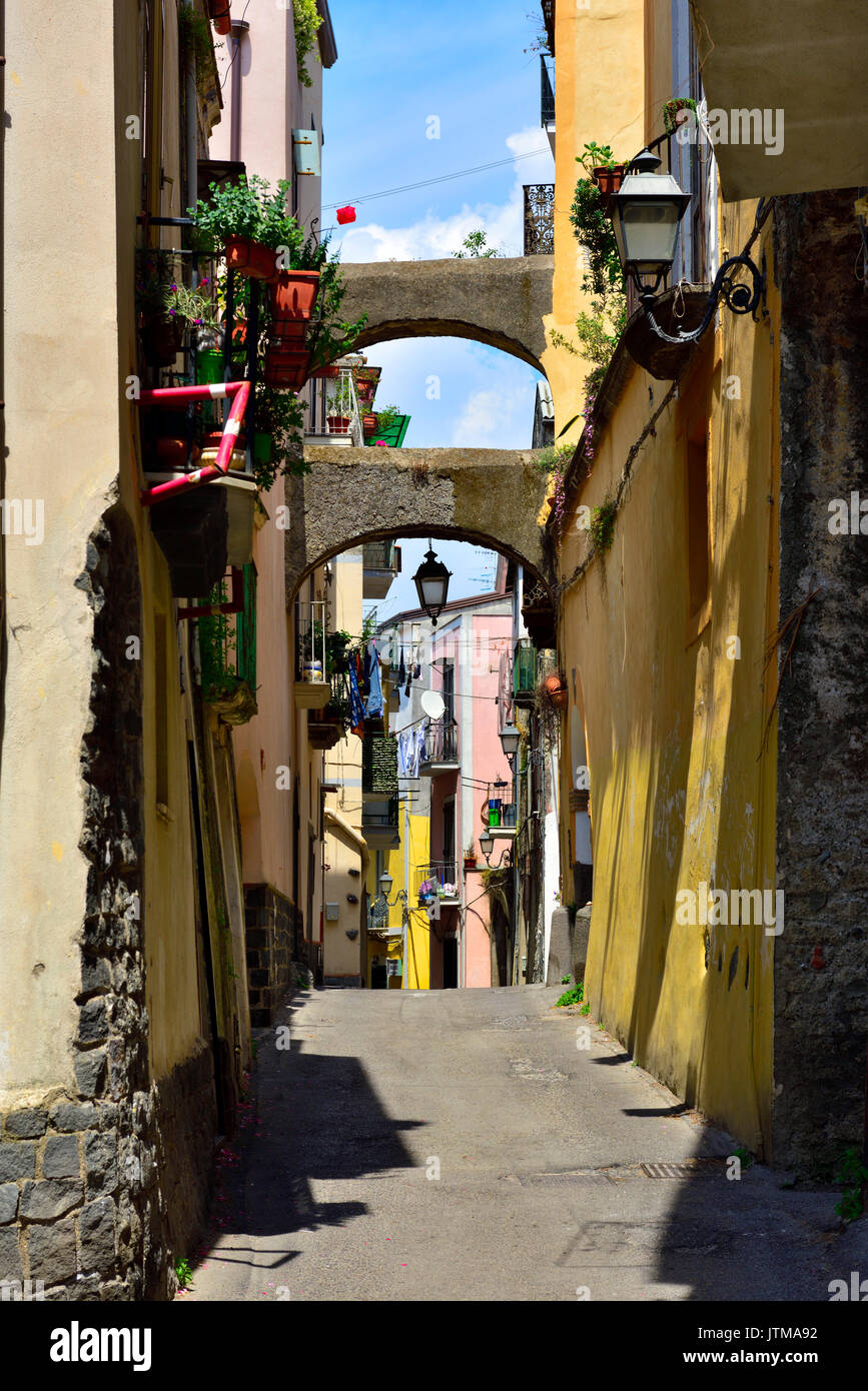 Picturesque narrow street interesting to explore, difficult to drive, town of Somma Vesuviana on outskirts of Naples, Italy Stock Photo