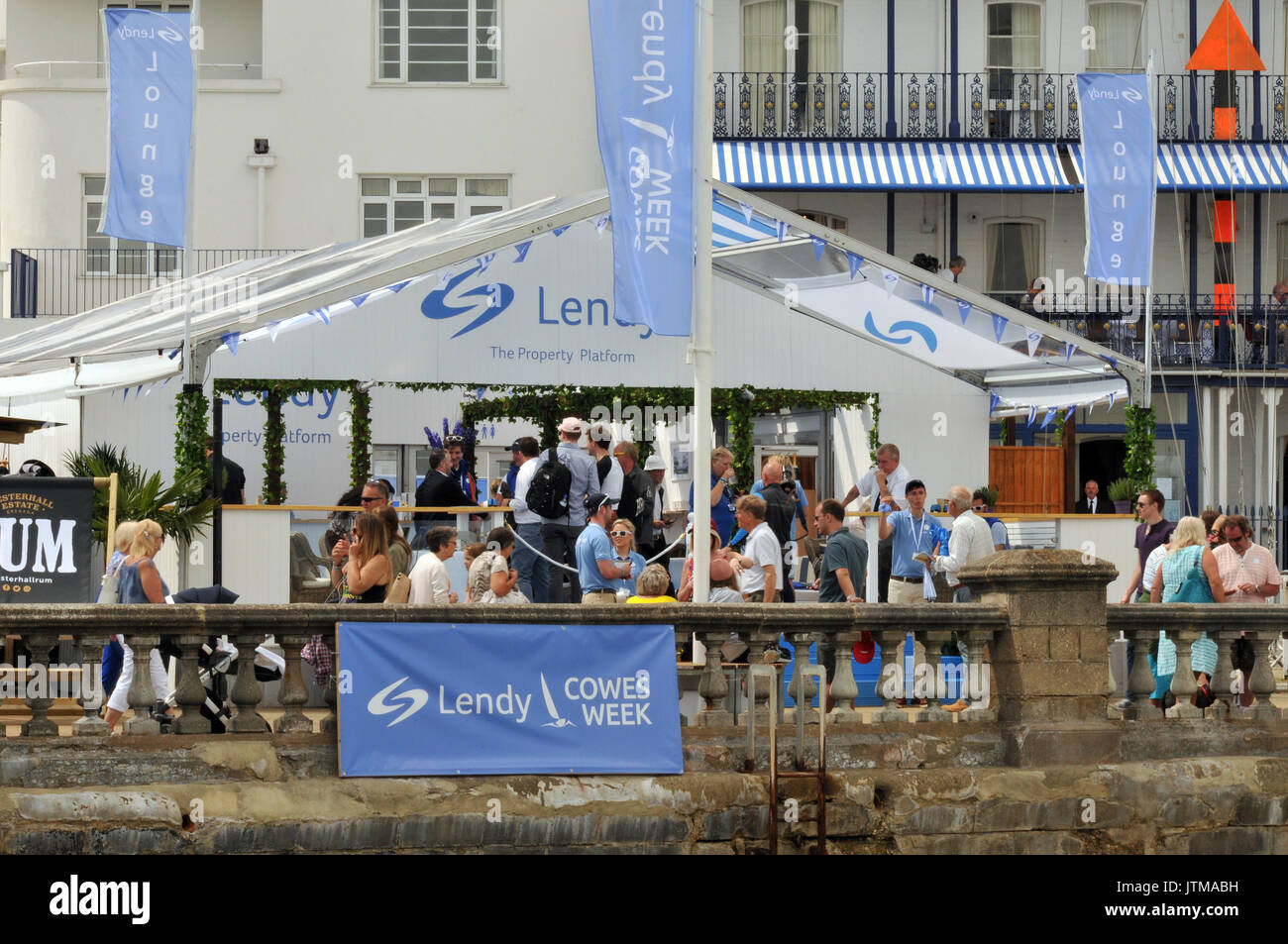 yachts yachting crowds and spectators atmosphere at cowes week on the isle of wight sailing boating regattas visitors tourists and competitors Stock Photo