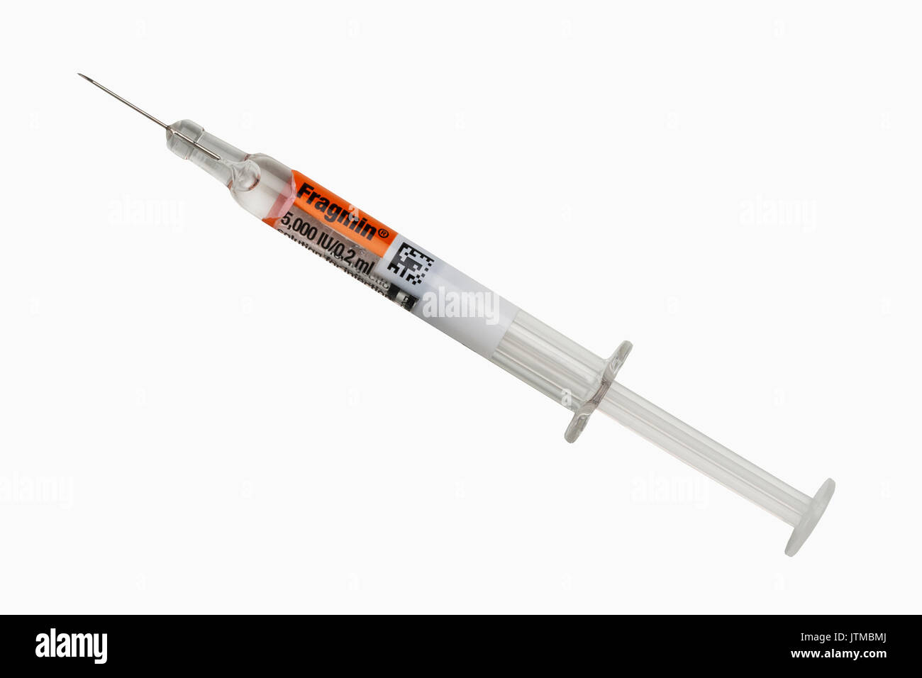 A syringe full of Fragmin to stop blood clotting on a white background Stock Photo