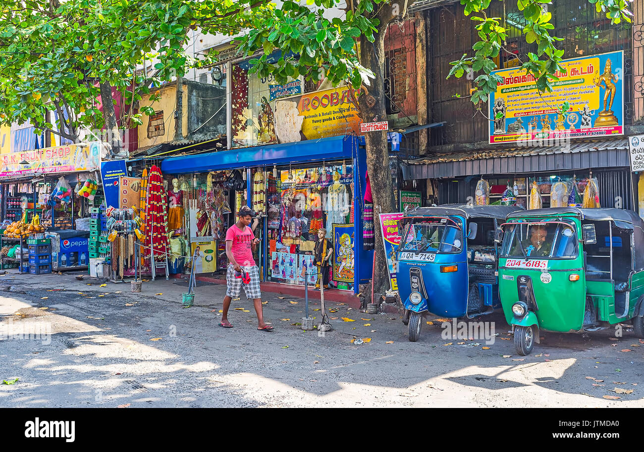 COLOMBO, SRI LANKA - DECEMBER 7, 2016: The Sea street is occupied with old stalls of Pettah market, here locate many religious stores because of the H Stock Photo