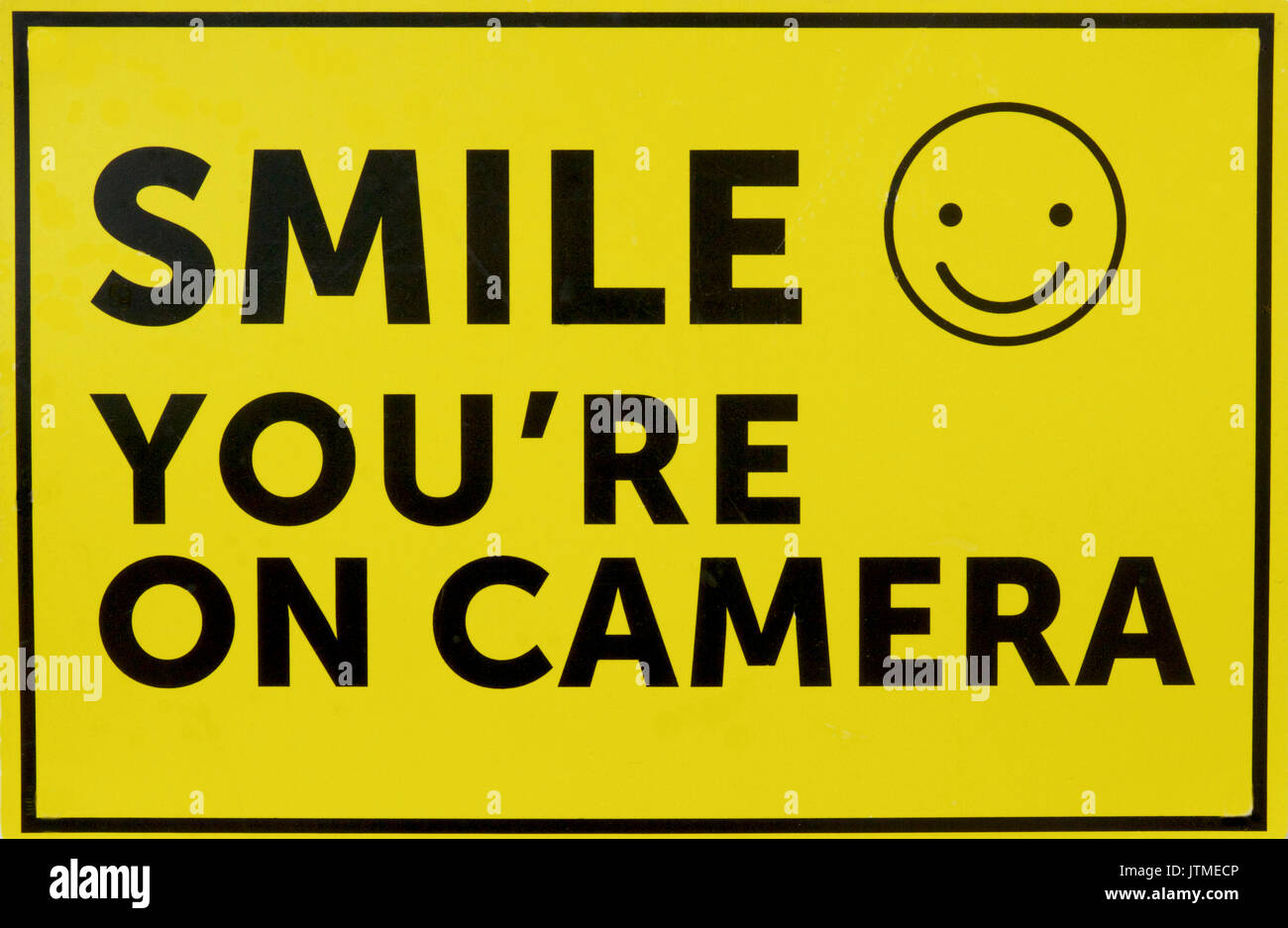 smile-you-re-on-camera-sign-stock-photo-alamy